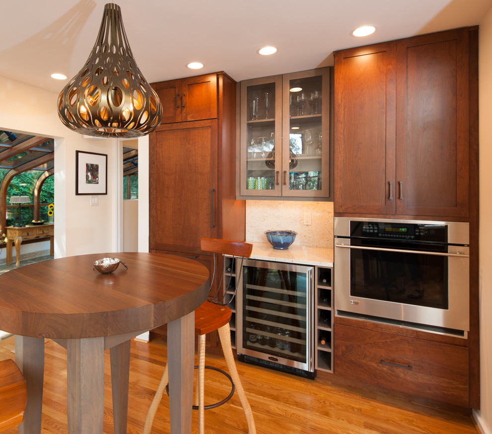 Large transitional kitchen photo in DC Metro with an undermount sink, shaker cabinets, granite countertops, stainless steel appliances and an island