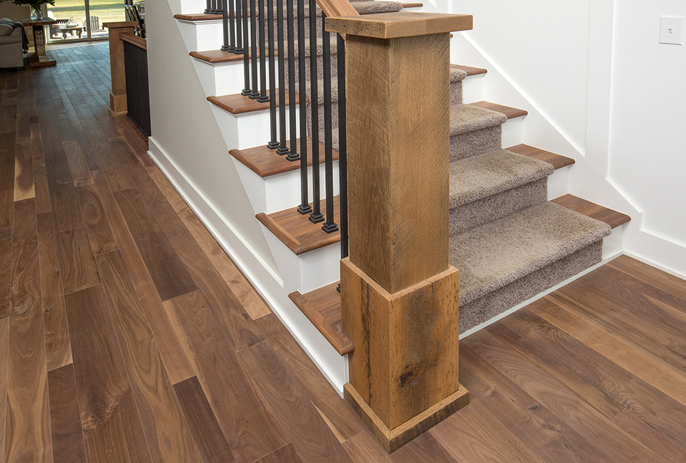 Photo of a large country wood straight staircase in Columbus with painted wood risers.