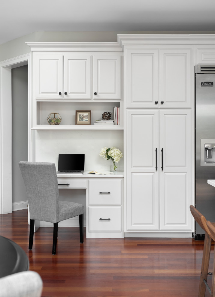 Large transitional u-shaped medium tone wood floor and vaulted ceiling eat-in kitchen photo in Chicago with a farmhouse sink, raised-panel cabinets, gray cabinets, quartz countertops, white backsplash, quartz backsplash, stainless steel appliances, an island and white countertops