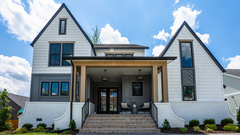 The Cardinal - Example of a large transitional white three-story gable roof design in Richmond with a mixed material roof and a black roof