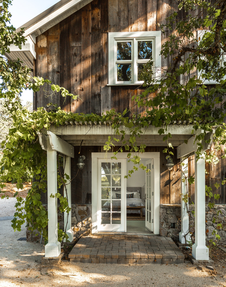 This is an example of a country front door in San Francisco with a double front door and a glass front door.