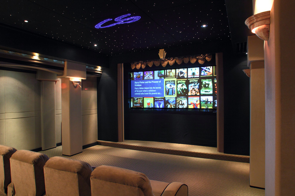 Mid-sized contemporary enclosed home theatre in San Francisco with beige walls, carpet and a projector screen.