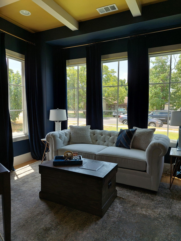 Design ideas for a mid-sized transitional study room in Dallas with blue walls, medium hardwood floors, no fireplace, a freestanding desk, beige floor and coffered.