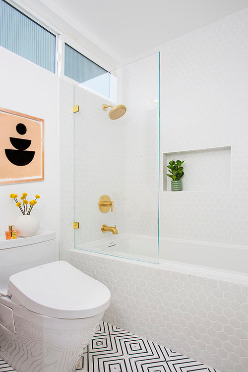 Mid-sized scandinavian bathroom in Los Angeles with flat-panel cabinets, medium wood cabinets, an alcove tub, a shower/bathtub combo, a bidet, mosaic tile, white walls, ceramic floors, a trough sink, multi-coloured floor and an open shower.