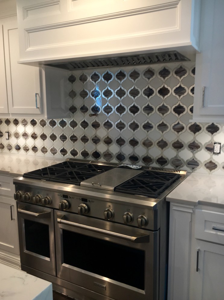 Example of a transitional kitchen design in New York