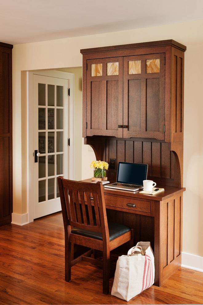 Arts and crafts home office in Bridgeport with beige walls and medium hardwood floors.