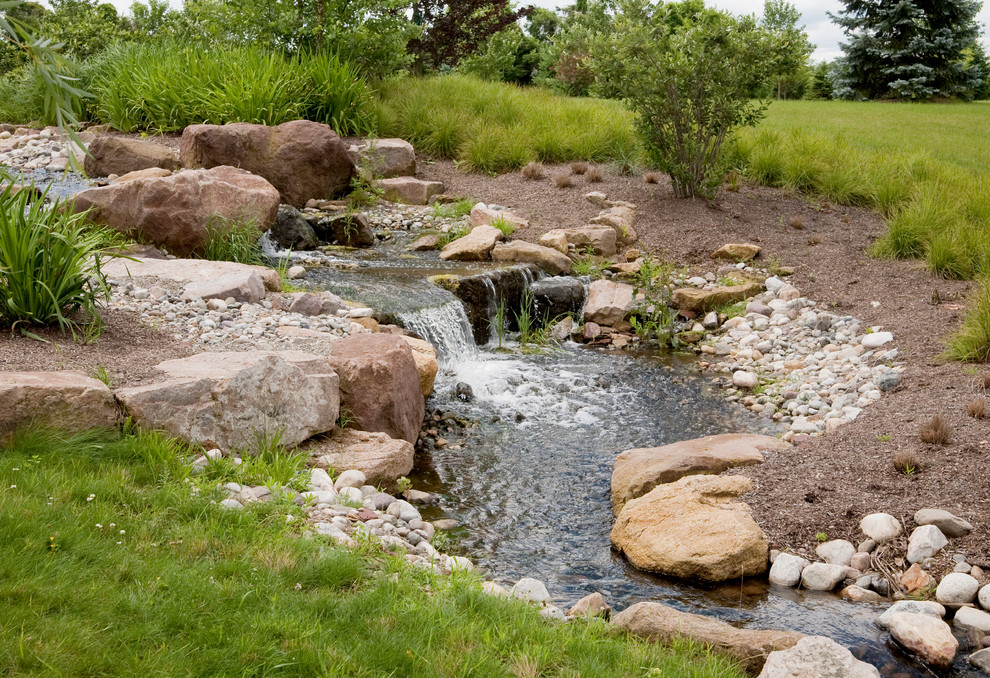 Design ideas for a country garden in Philadelphia with a water feature.