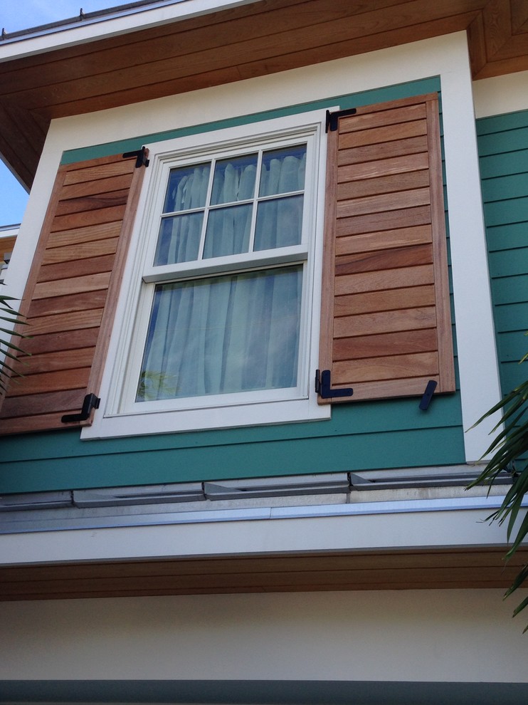 This is an example of a large beach style two-storey exterior in Tampa with concrete fiberboard siding.