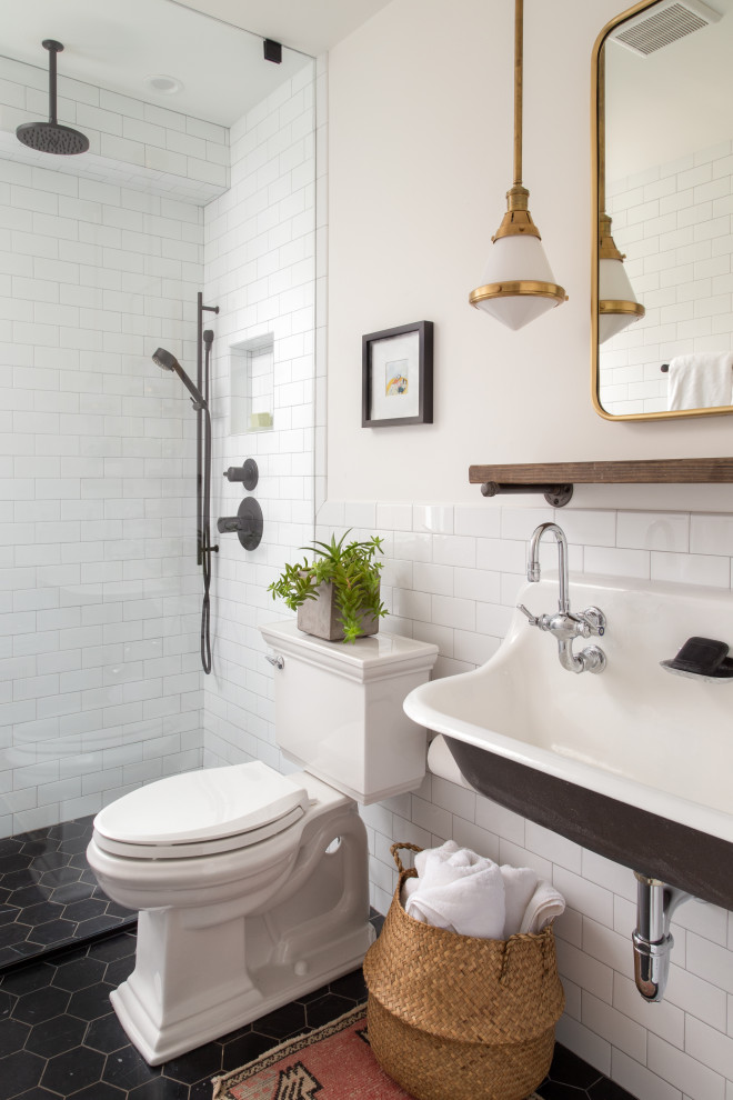 Inspiration for a transitional 3/4 bathroom in DC Metro with a curbless shower, white tile, porcelain tile, white walls, marble floors, a trough sink and black floor.