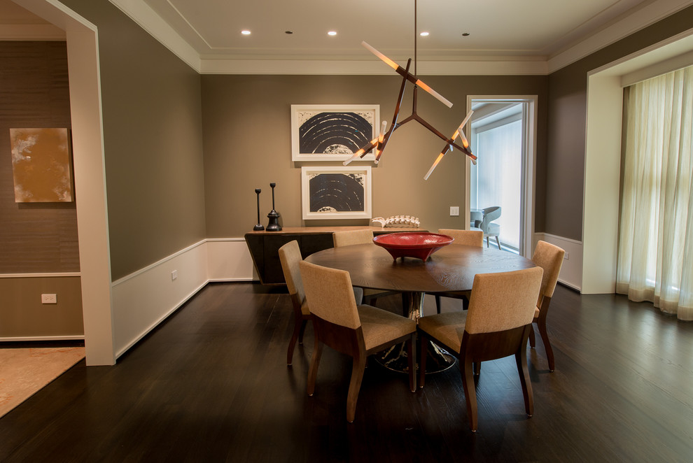 Design ideas for a contemporary dining room in Chicago with beige walls and dark hardwood floors.