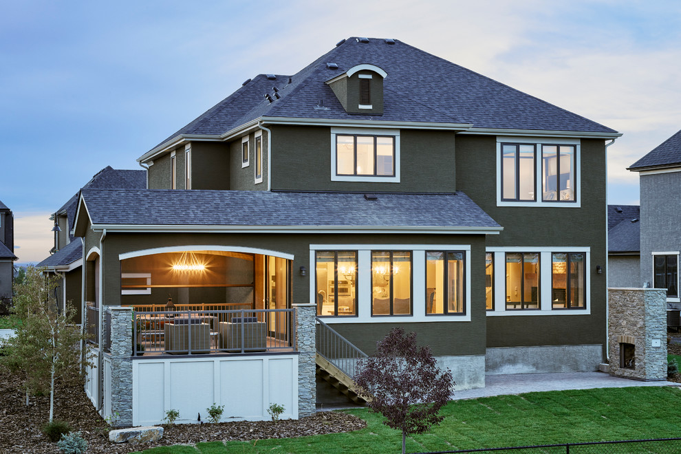 Deck - transitional backyard balcony deck idea in Calgary with a roof extension