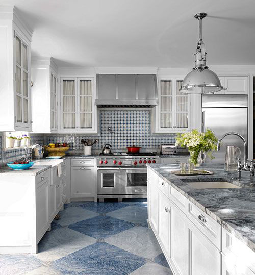 Traditional u-shaped kitchen in Nashville with a farmhouse sink, glass-front cabinets, white cabinets, marble benchtops, blue splashback, ceramic splashback, stainless steel appliances, painted wood floors and with island.