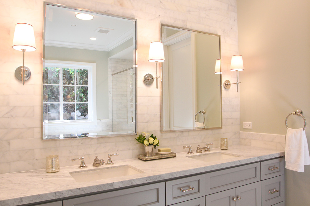 This is an example of a large traditional master bathroom in San Francisco with an undermount sink, recessed-panel cabinets, grey cabinets, marble benchtops, an undermount tub, a double shower, a two-piece toilet, white tile, stone tile, grey walls, marble floors, grey floor and a hinged shower door.