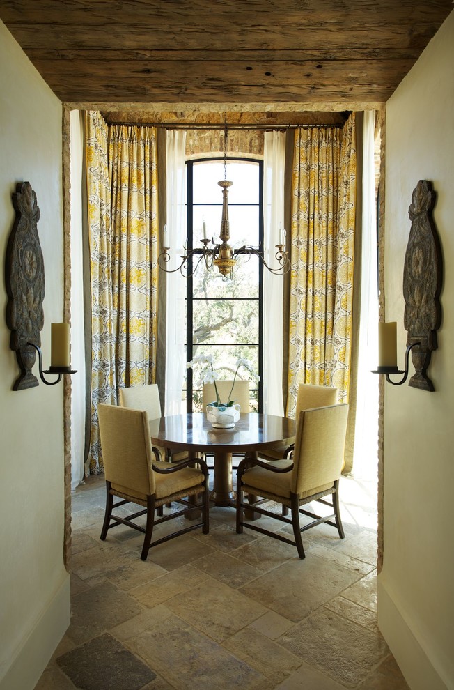 Design ideas for a mediterranean dining room in Los Angeles with beige walls.