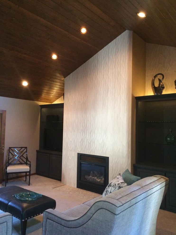 This is an example of a mid-sized transitional living room in Milwaukee with a standard fireplace and a tile fireplace surround.