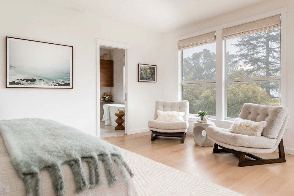 Photo of a medium sized beach style master bedroom in San Francisco with white walls, light hardwood flooring and beige floors.