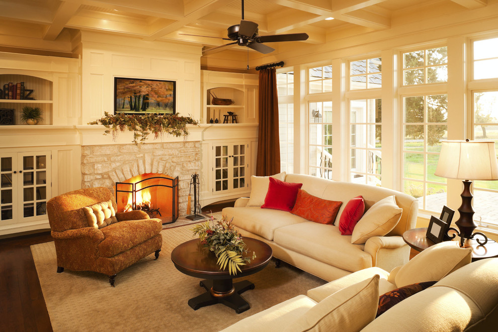 Photo of a mid-sized transitional formal open concept living room in Albuquerque with beige walls, dark hardwood floors, a standard fireplace, a stone fireplace surround and brown floor.