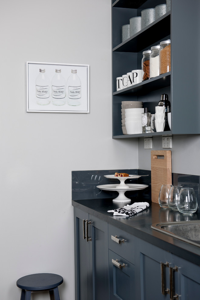 Photo of a large modern galley kitchen pantry in Melbourne with a double-bowl sink, shaker cabinets, grey cabinets, granite benchtops, grey splashback, glass sheet splashback, stainless steel appliances, ceramic floors and with island.