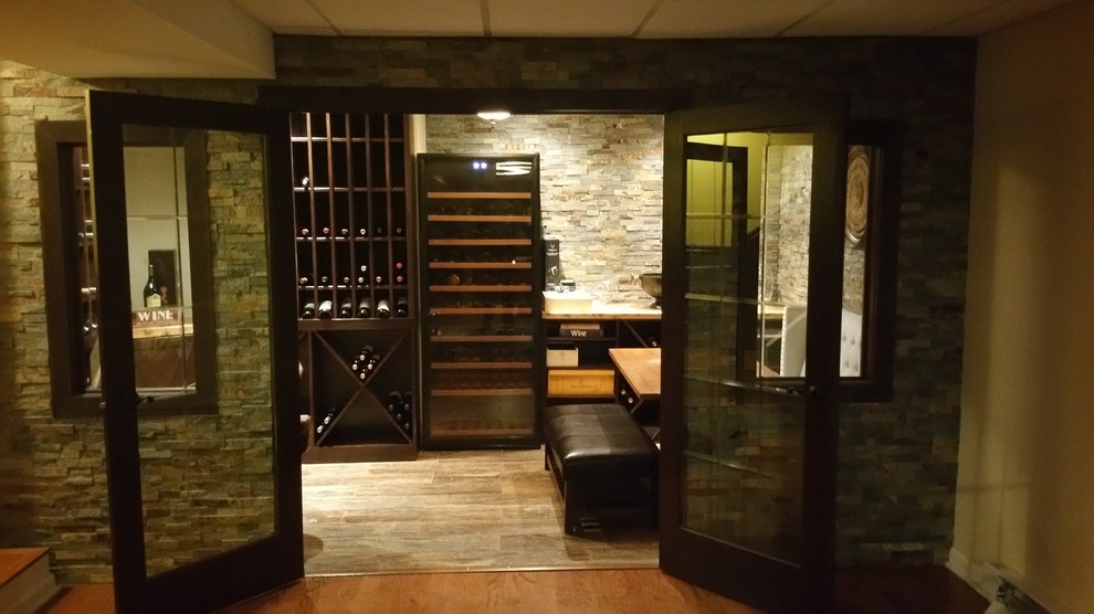 Wine cellar - large traditional wine cellar idea in New York with storage racks