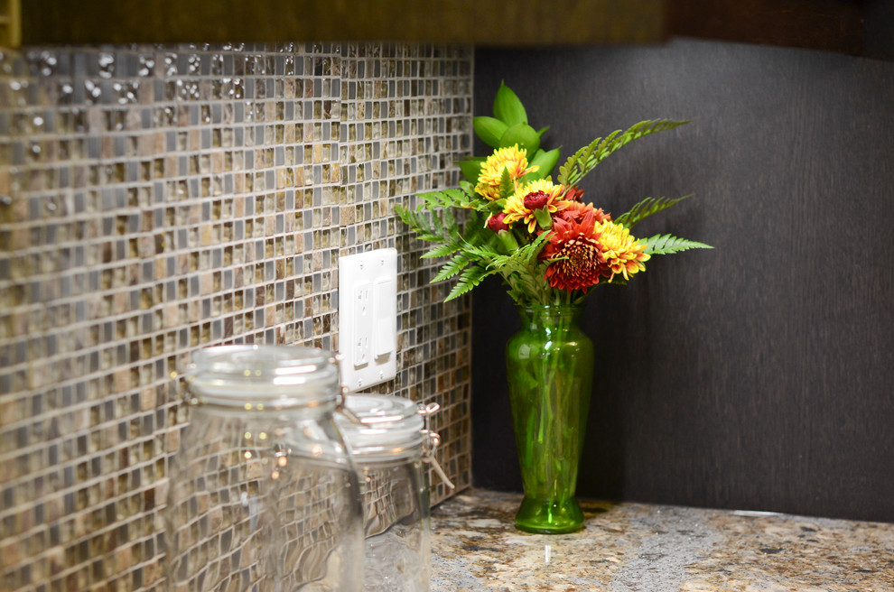 Example of a mid-sized transitional galley porcelain tile kitchen design in Ottawa with an undermount sink, glass-front cabinets, brown cabinets, quartz countertops, brown backsplash, glass sheet backsplash and stainless steel appliances