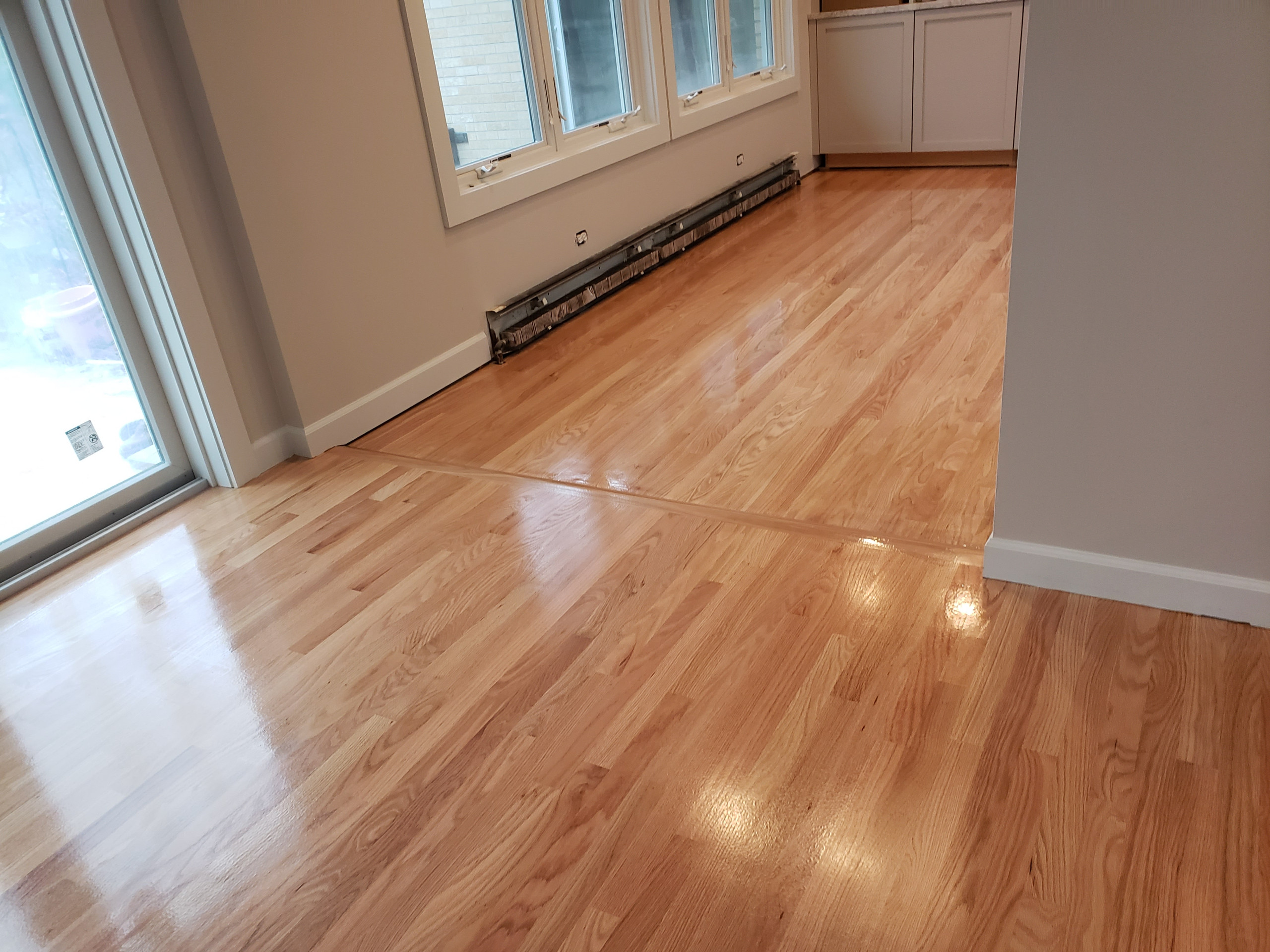 Hawthorn Woods,  2 and 1/4 red oak , 3 coats Bona Traffic Hd
