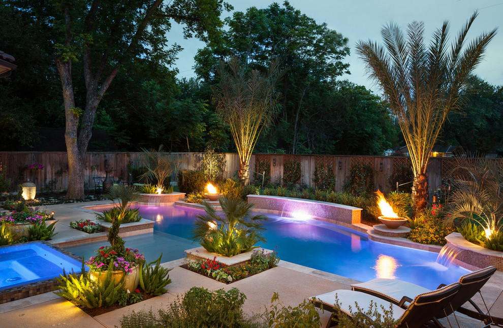 Inspiration for a mediterranean backyard custom-shaped pool remodel in Houston