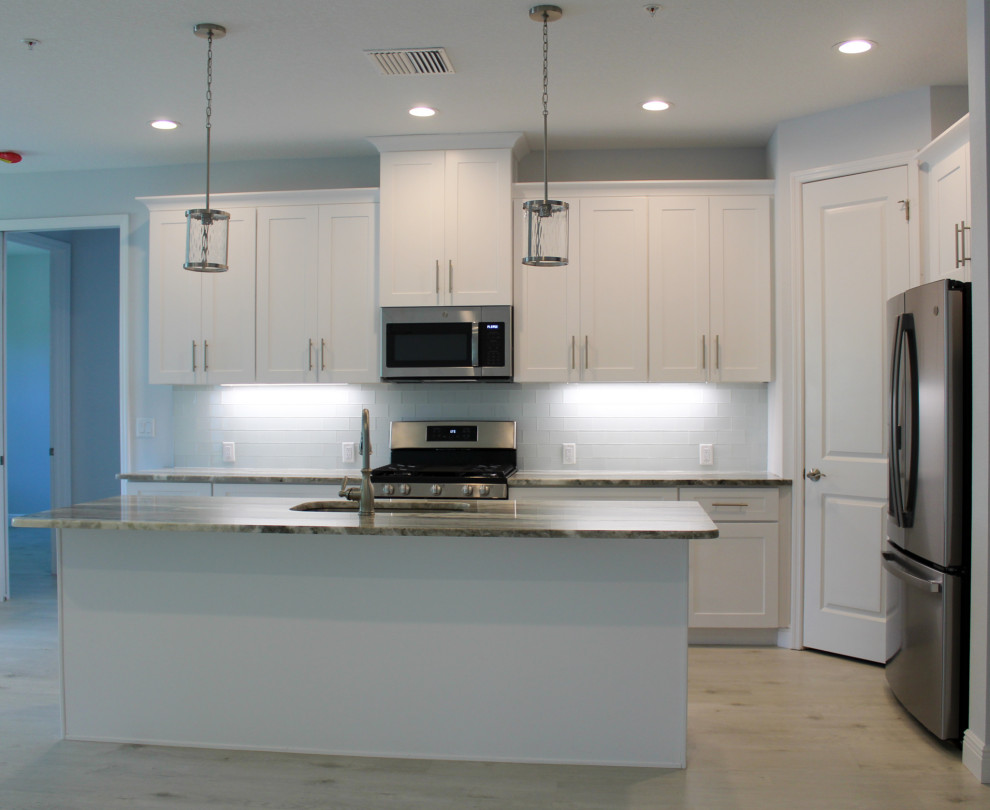 Example of a mid-sized beach style kitchen design in Tampa