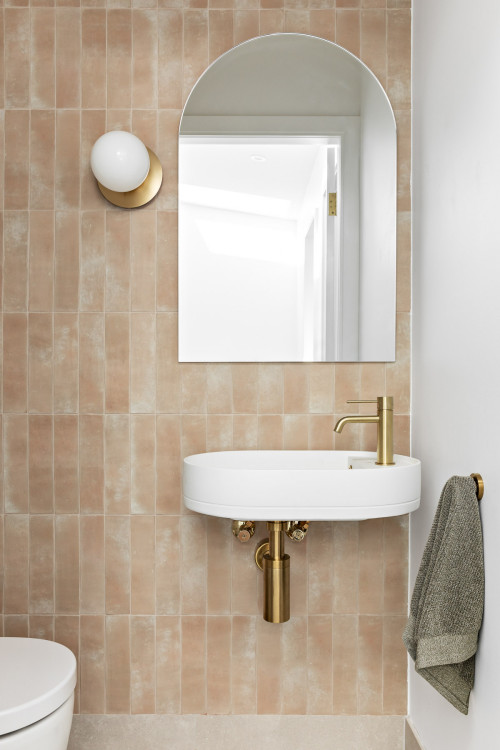 Cozy Elegance: Subway Tile Backsplash and Wall-Mounted Basin Sink
