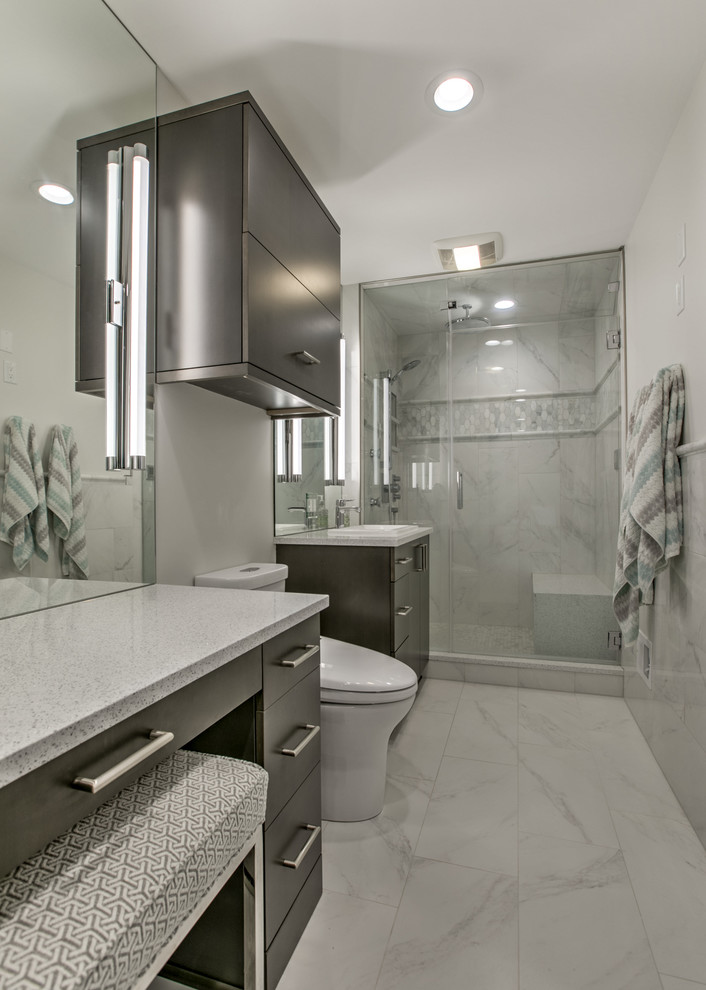 Inspiration for a small modern master bathroom in Omaha with flat-panel cabinets, medium wood cabinets, multi-coloured tile, marble, marble floors, a drop-in sink, engineered quartz benchtops and multi-coloured floor.