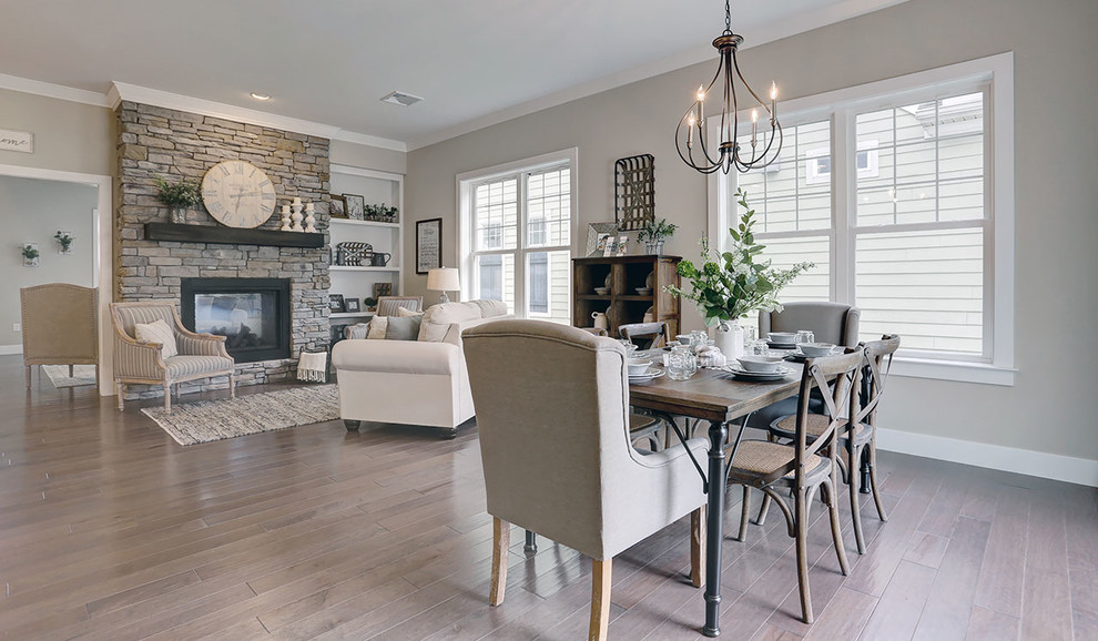 This is an example of a mid-sized country open plan dining in Other with grey walls and dark hardwood floors.