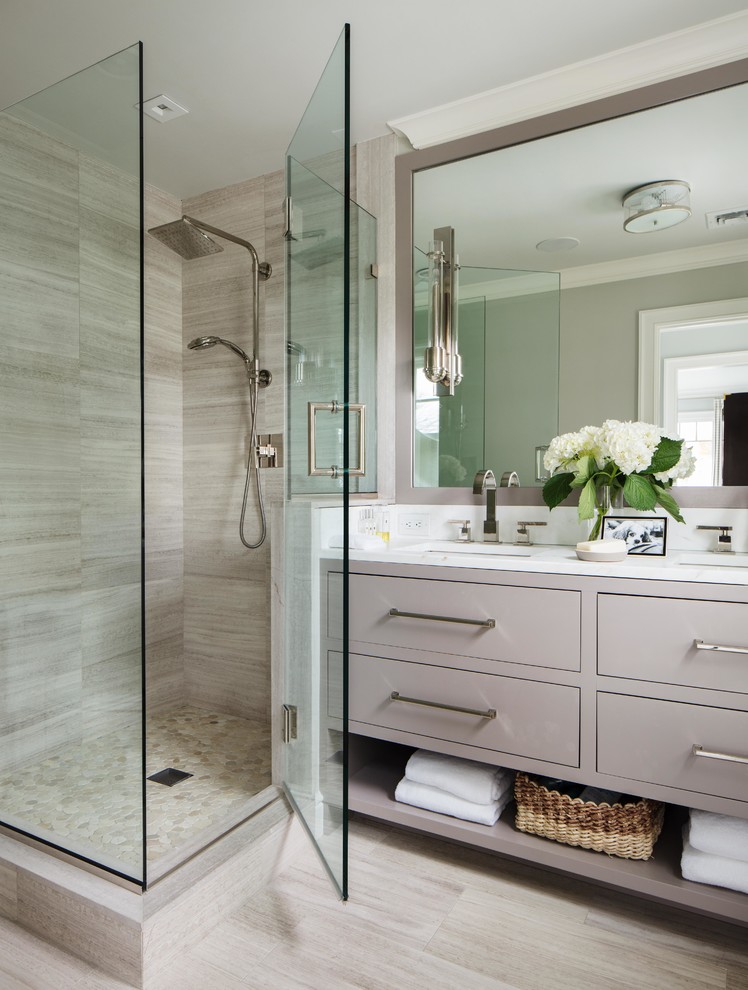 Inspiration for a small beach style master bathroom in New York with beige cabinets, an alcove shower, a two-piece toilet, beige tile, porcelain tile, white walls, porcelain floors, an undermount sink, marble benchtops, beige floor and a hinged shower door.