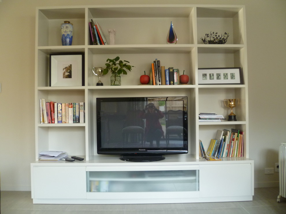 Mid-sized modern Enclosed living room in Auckland With Beige Walls, Carpet, No Fireplace and a Freestanding TV.