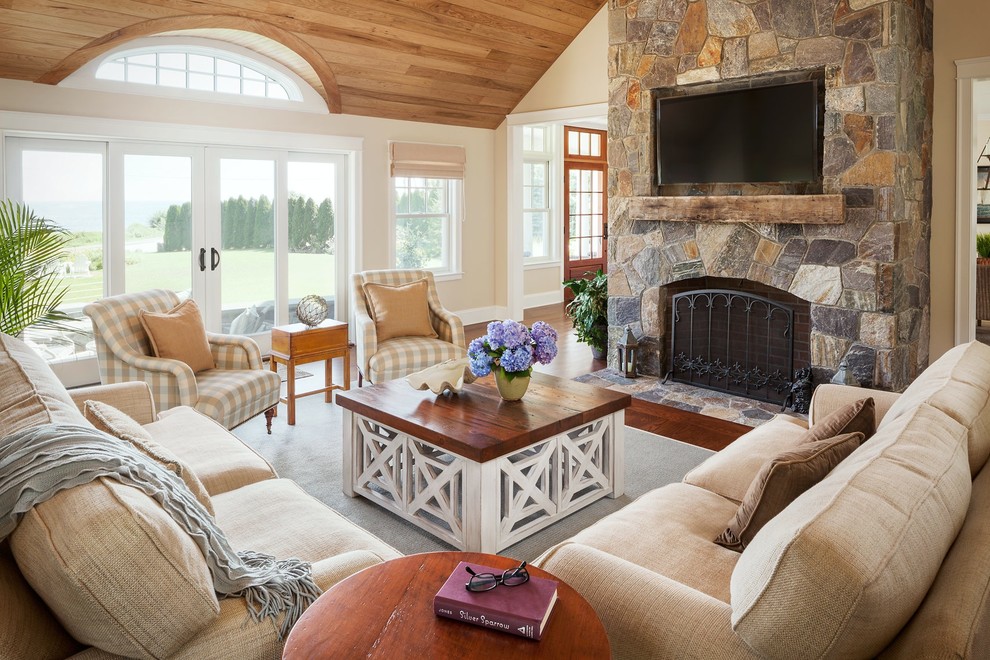 Photo of a traditional living room in Portland Maine with beige walls.