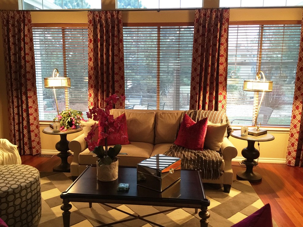 Example of a transitional home design design in Denver