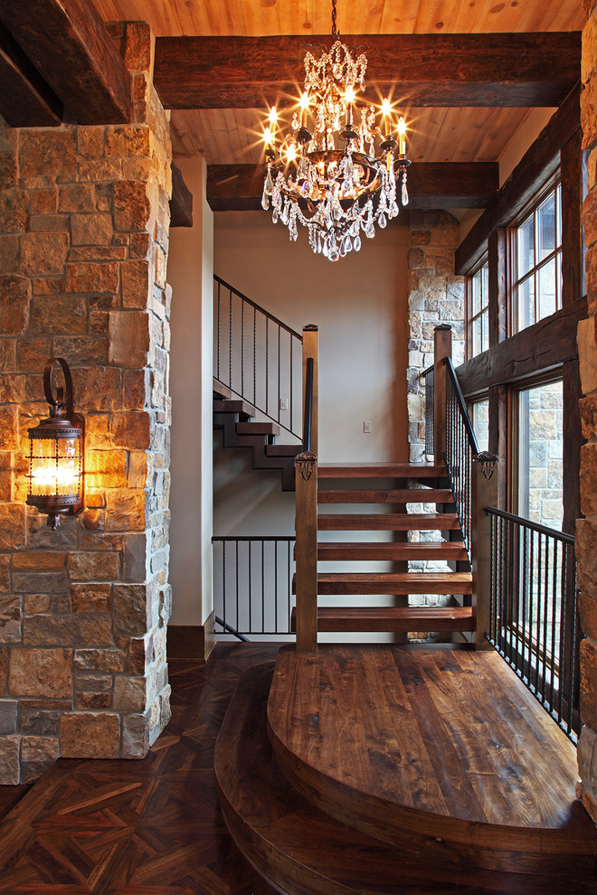 Inspiration for a large country foyer in Minneapolis with beige walls, dark hardwood floors and a single front door.