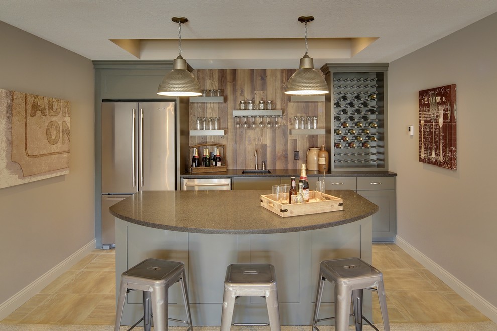 Inspiration for a transitional wet bar in Minneapolis with an undermount sink, shaker cabinets, grey cabinets, beige floor and grey benchtop.