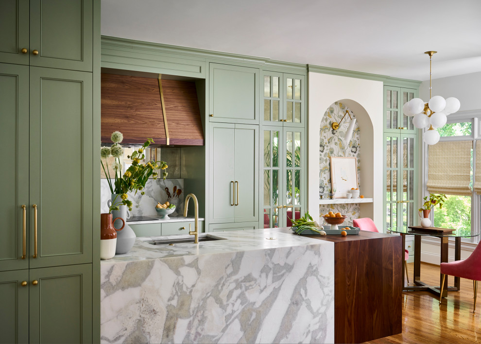 Mid-sized transitional galley medium tone wood floor and brown floor open concept kitchen photo in Atlanta with an undermount sink, recessed-panel cabinets, green cabinets, marble countertops, white backsplash, marble backsplash, paneled appliances, an island and white countertops