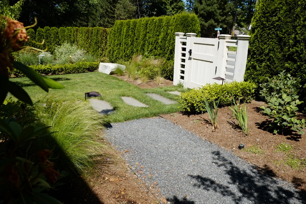Photo of a mid-sized modern backyard full sun formal garden in Seattle with concrete pavers and a garden path.
