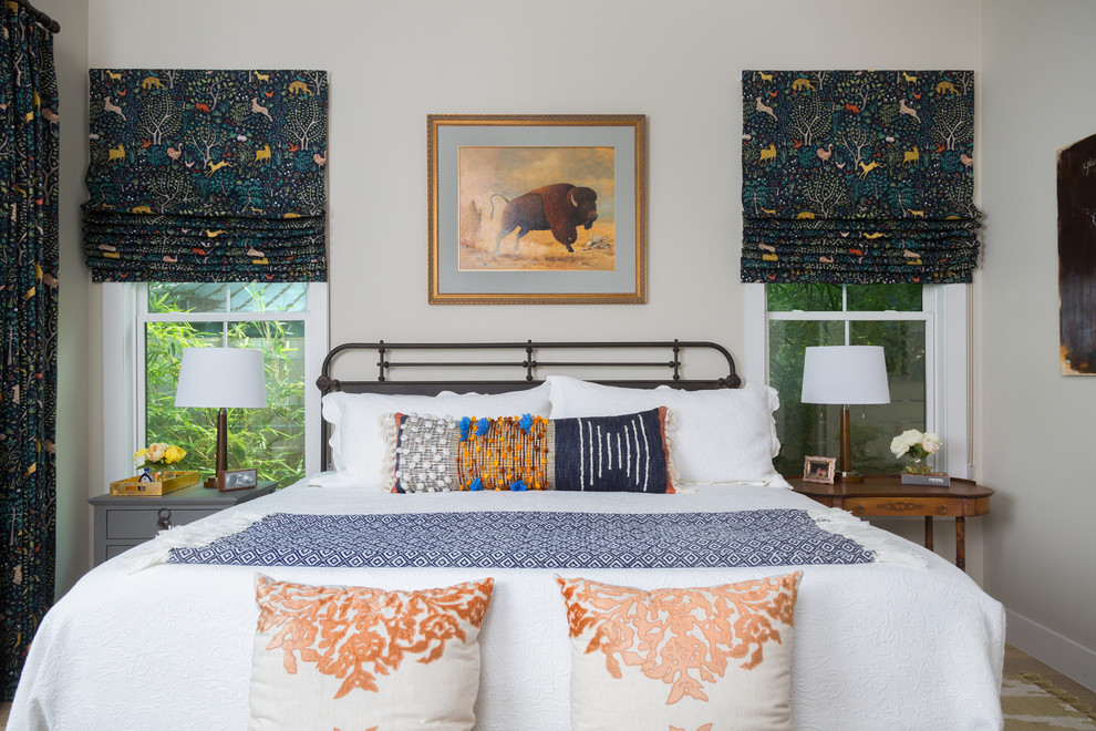 Design ideas for a transitional master bedroom in Austin with beige walls.