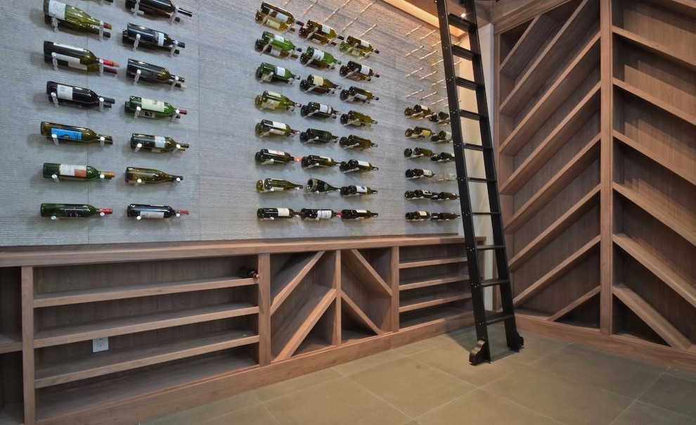 Design ideas for a large transitional wine cellar in Los Angeles with slate floors, display racks and grey floor.