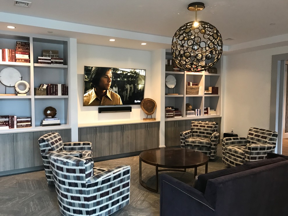 Inspiration for a mid-sized transitional enclosed family room in Boston with white walls, dark hardwood floors, no fireplace, a built-in media wall and brown floor.