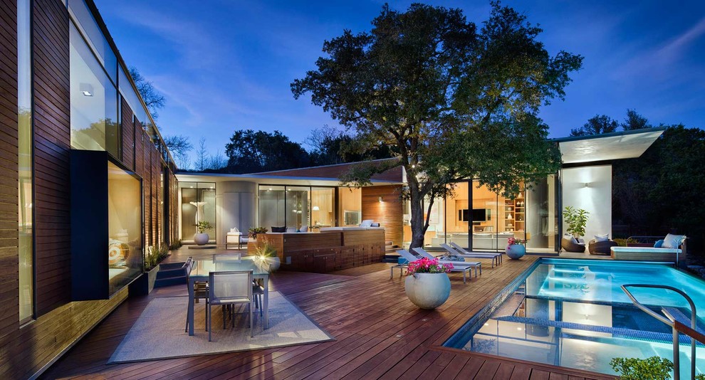 Deck - large modern backyard deck idea in Austin with no cover