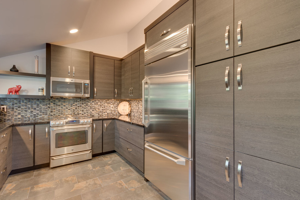 Example of a mid-sized transitional u-shaped slate floor and brown floor enclosed kitchen design with an undermount sink, granite countertops, stainless steel appliances, flat-panel cabinets, dark wood cabinets, multicolored backsplash, mosaic tile backsplash and no island