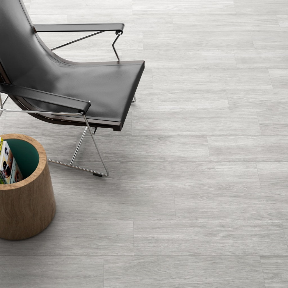 Immagine di un soggiorno di medie dimensioni con pavimento in gres porcellanato e pavimento grigio