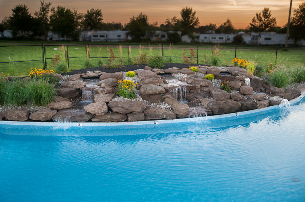 Huge mountain style courtyard stamped concrete and freeform natural pool fountain photo