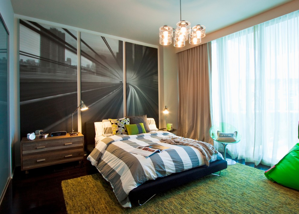 This is an example of a contemporary bedroom in Miami with dark hardwood floors.