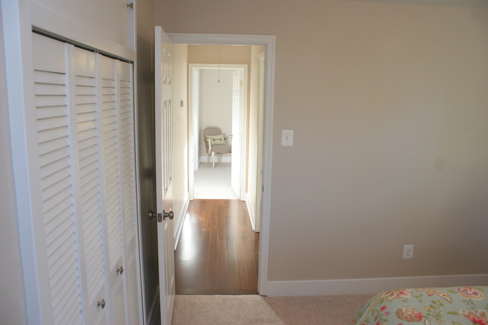 Hallway - mid-sized modern dark wood floor hallway idea in Baltimore with beige walls