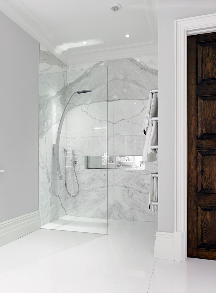 Inspiration for a large contemporary master bathroom in London with a curbless shower, grey walls, marble, porcelain floors, white floor and an open shower.