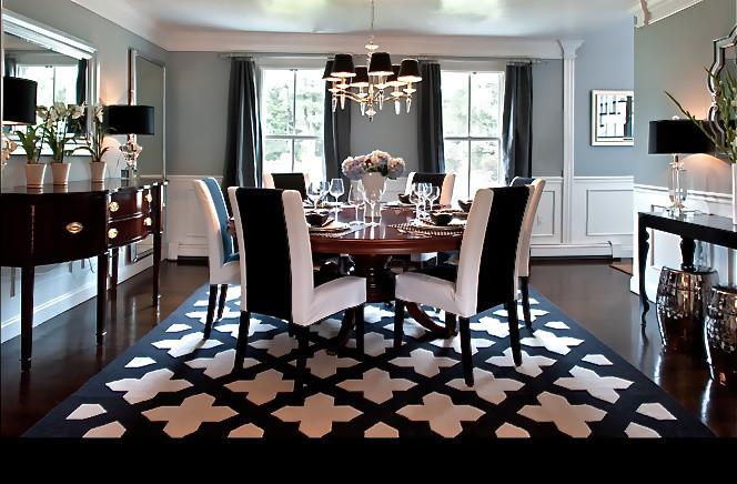 Example of a mid-sized transitional dark wood floor enclosed dining room design in Boston with gray walls