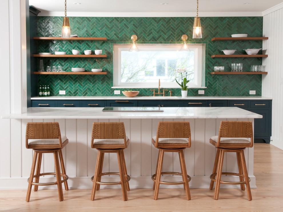 Transitional galley kitchen in Other with an undermount sink, shaker cabinets, green cabinets, green splashback, mosaic tile splashback, light hardwood floors, a peninsula, brown floor and white benchtop.
